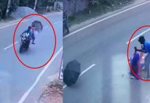மோட்டார் சைக்கிளில் செல்லும்போது குடையை விரித்த பெண்ணுக்கு நேர்ந்த சோ கம்!!